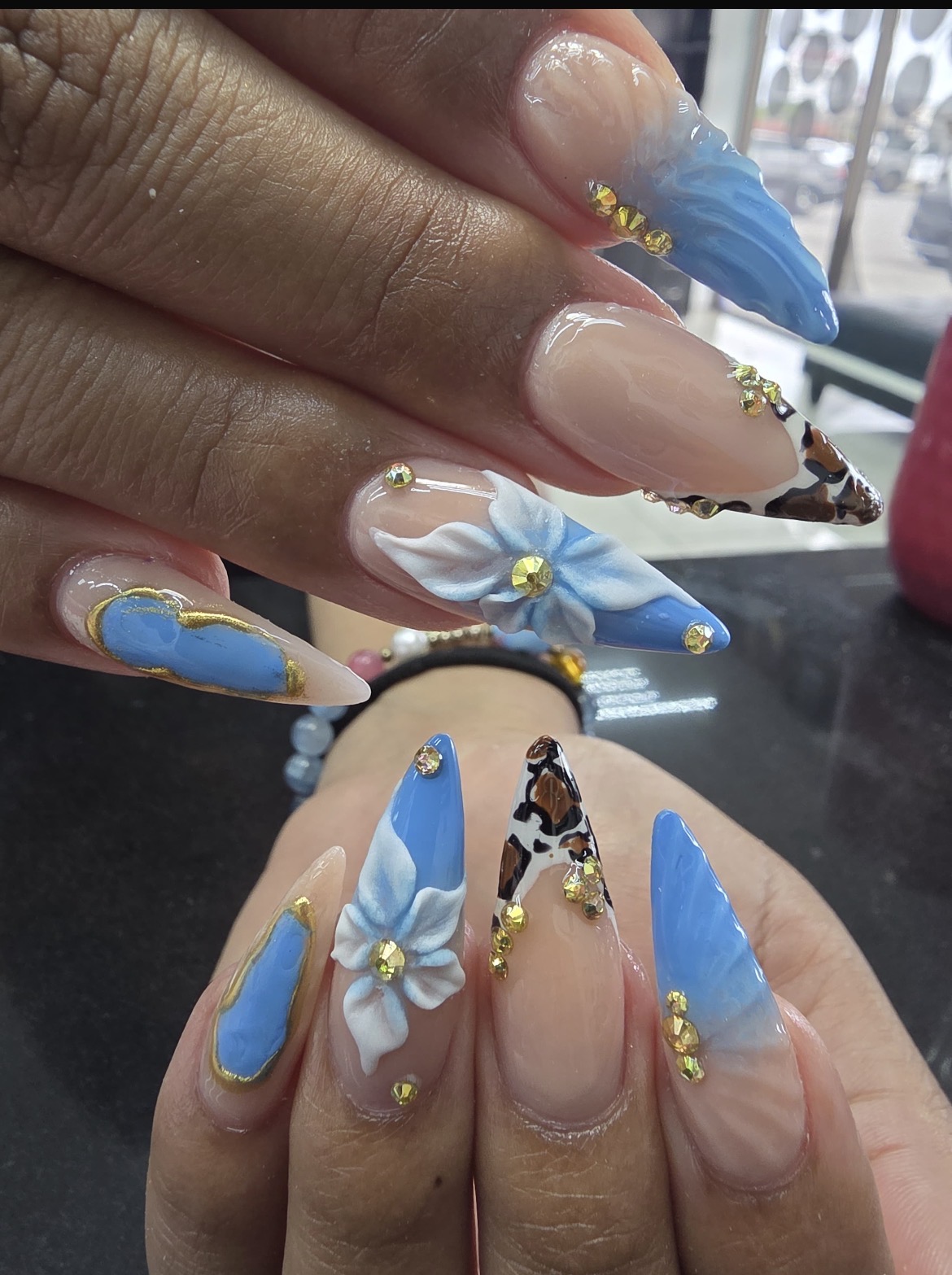 Nail art by the shop's nail tech